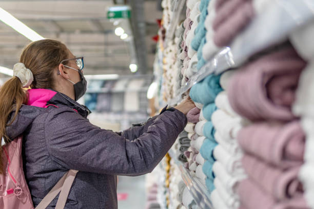 istock Woman in a store chooses textiles. 1368976860