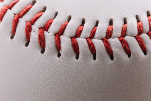 istock A baseball used to play baseball - white leather on top with red threads 1368979417