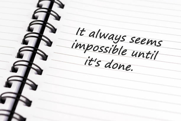 inspirational quotes - it always seem impossible until it's done - possible imagens e fotografias de stock