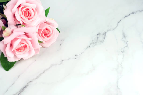 istock Pink Roses bouquet on marble background with copy  space 1368982304