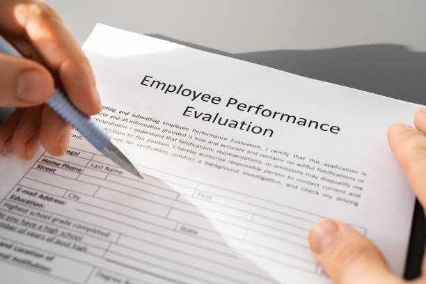 istock Person Filling A Performance Evaluation Form 1368983643