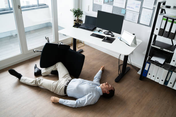 Faint Accident In Office. Fall From Chair Faint Accident In Office. Fall From Chair At Workplace fainted stock pictures, royalty-free photos & images