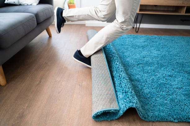 istock Man Carpet Stumble Accident And Falldown 1368983942