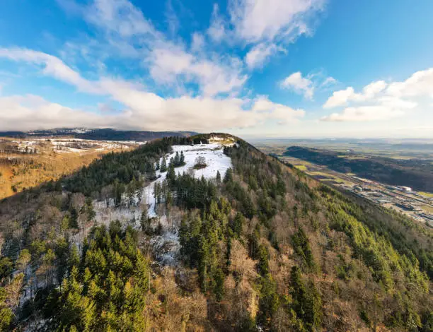 View of the partly snow-covered Bözingenberg mountain located directly next to the city of Biel Bienne, canton of Bern, Switzerland