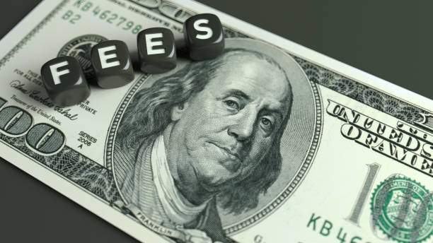 istock American one hundred dollar bill and fees text. 1368985577
