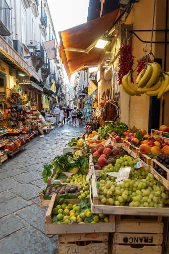 Sorrento Naples Italy on September 2, 2021 colorful shops in the old city. Greengrocery stall with grapes.