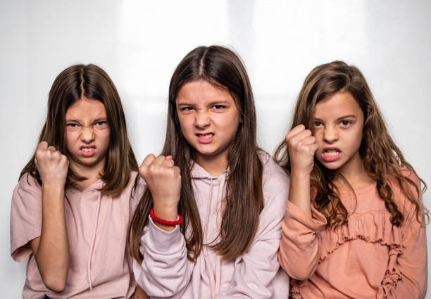 Portrait three cute angry girls