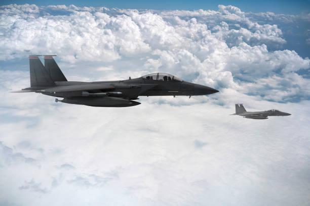 istock Jet fighters flying over the clouds. 1368990286