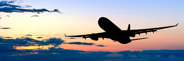 istock XL jet airplane taking off at dusk 136899453