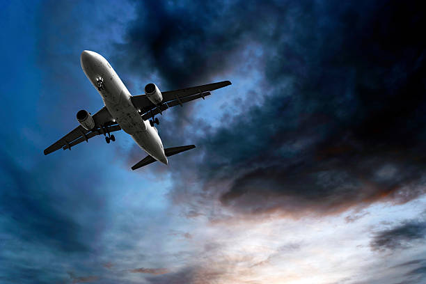istock jet airplane landing at dusk 136899526