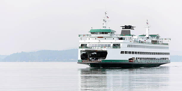 large passenger ferry large washington state ferry approaches for docking, panoramic frame elliott bay photos stock pictures, royalty-free photos & images