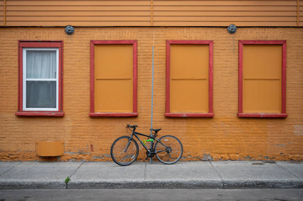 istock Bike Against Brick Wall With Windows 1368995464