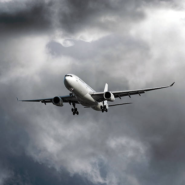 istock jet airplane landing in storm 136899548