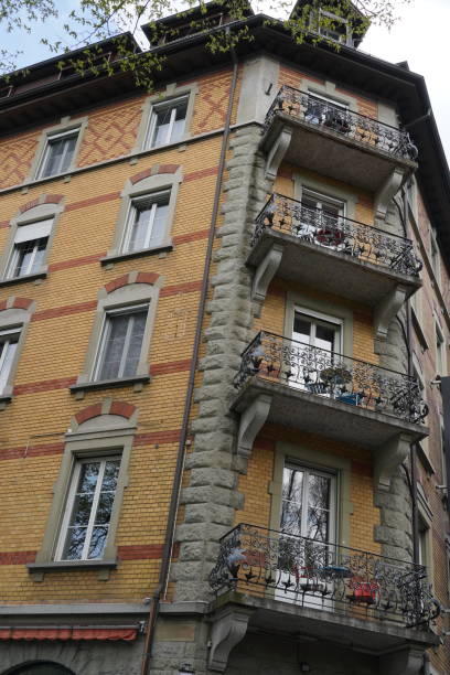 istock Old brick residential building with windows and balconies. 1368995705