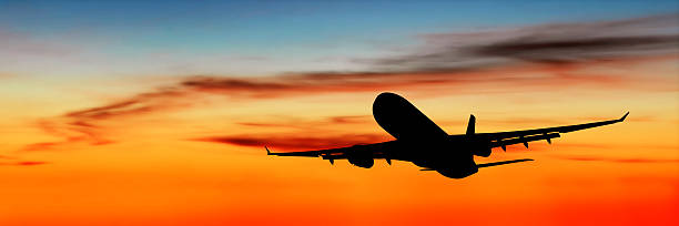 XL jet airplane taking off at dusk