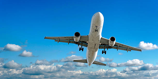 istock jet airplane landing in bright sky 136899649