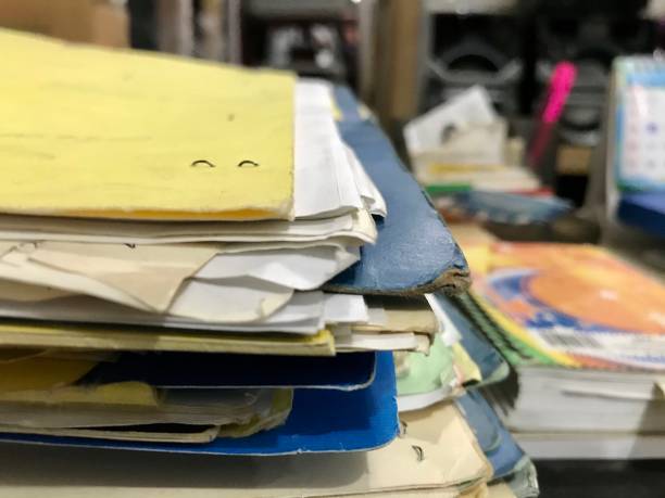 istock Some file folders stacked on top of a desk 1368996803