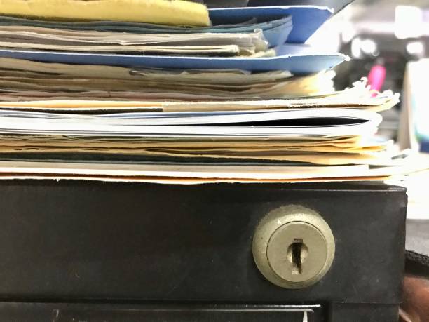 istock Some file folders stacked on top of a desk 1368996832