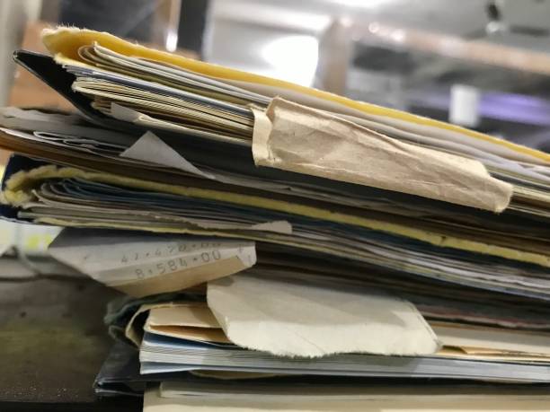 istock Some file folders stacked on top of a desk 1368997033