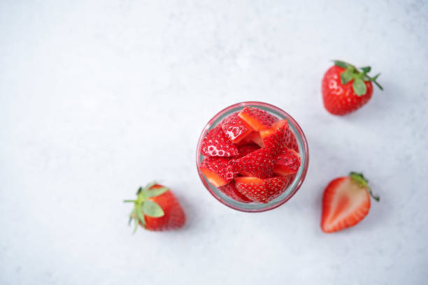 istock Greek yogurt strawberry parfait in jars 1368997136