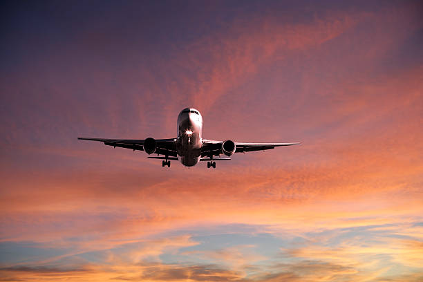 istock XXL jet airplane landing at sunset 136899772