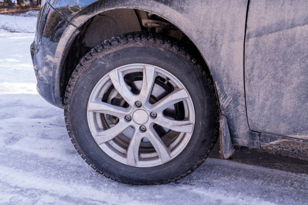 istock a car wheel with spikes in the snow 1368998405