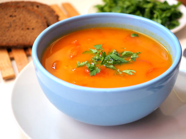 istock Vegetarian pumpkin soup with fresh herbs 1368998429