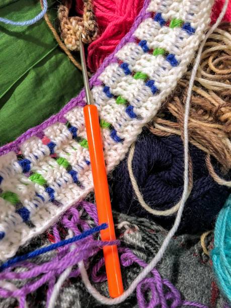 istock Traditional handmade equipment, hook, yarn, crocheted sample 1368998456