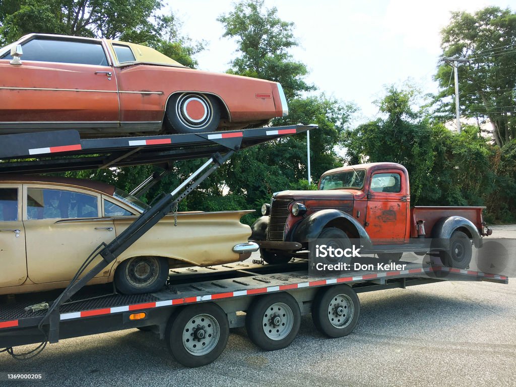 Anitque Automobiles, Vintage Cars and Pickup Truck on a Car Carrier Vehicle Pick-up Truck Stock Photo