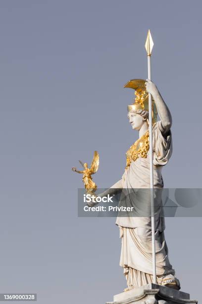 Statue Of Pallas Athena Brunnen With Gray Sky Near Parliament Building In Vienna Austria Stock Photo - Download Image Now