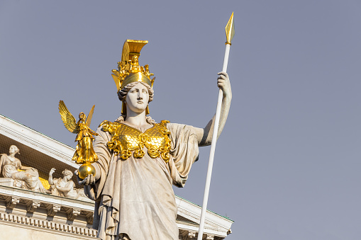 Sculpture of Athena, the Greek goddess of wisdom,outside the Austrian Parliament Building in Vienna, Austria