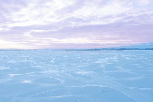 Scenic view of frozen lake against sky during winter