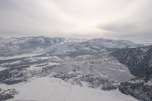 Aerial view of snow covered marble quarry in Burdur, Turkey. Taken via drone.