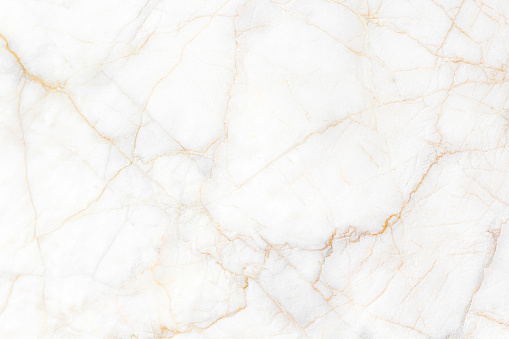 White and gold marble texture background. Used in design for skin tile ,wallpaper, interiors backdrop. Natural patterns. Picture high resolution. Luxurious background