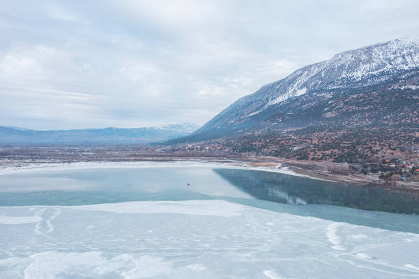 Aerial view of town by the frozen lake. Denizli, Turkey. Taken via drone.