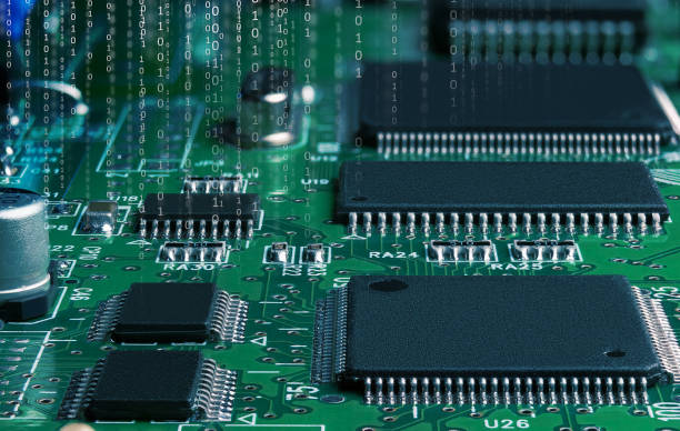 istock electronic circuit board with passive and active circuit components and IC close-up 1369006669