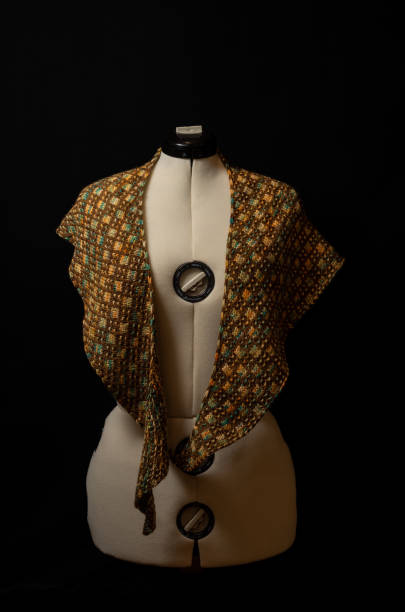 istock Handmade shawl crochet on a white mannequin - multicolored yarn. 1369006905