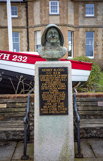 Cromer, Norfolk, UK - February 2022. Commemorative statue of Henry Blogg, a coxswain of Cromer lifeboat from 1909 to 1947