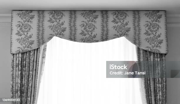 Black And White Image Of Pelmet And Brocade Curtains With Voile Curtains Stock Photo - Download Image Now
