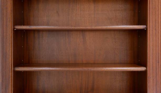 istock Dark wood bookshelves 1369008146