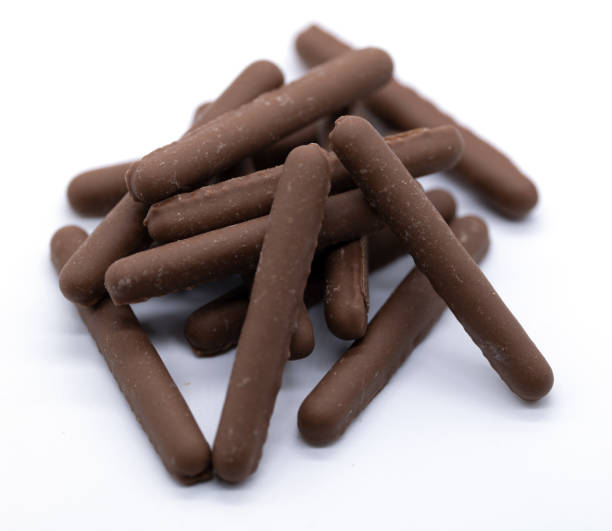 Stack of chocolate covered biscuits cookies Pile of Chocolate biscuits cookies dripped in chocolate chocolate fingers stock pictures, royalty-free photos & images