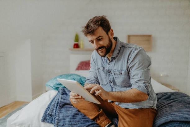 istock Young man in the bedroom 1369009557