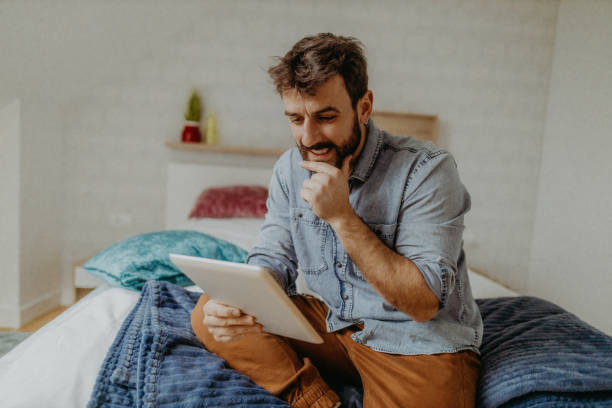 istock Young man in the bedroom 1369009558