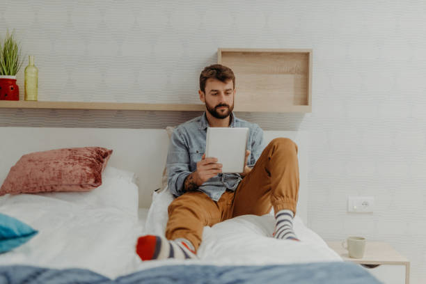 istock Young man in the bedroom 1369010315
