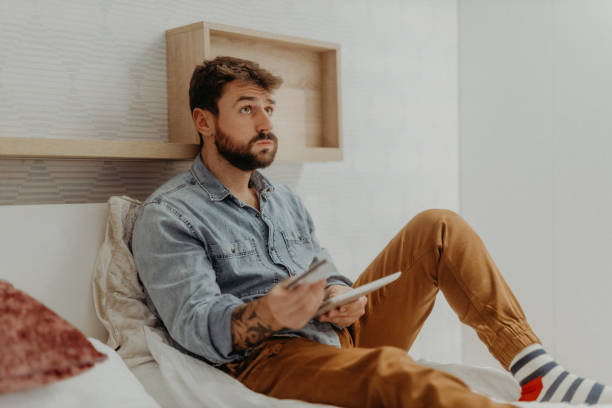 istock Young man in the bedroom 1369010349