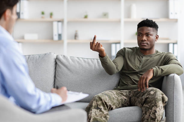 istock Agressive black military man showing his psychologist inappropriate gesture 1369012942