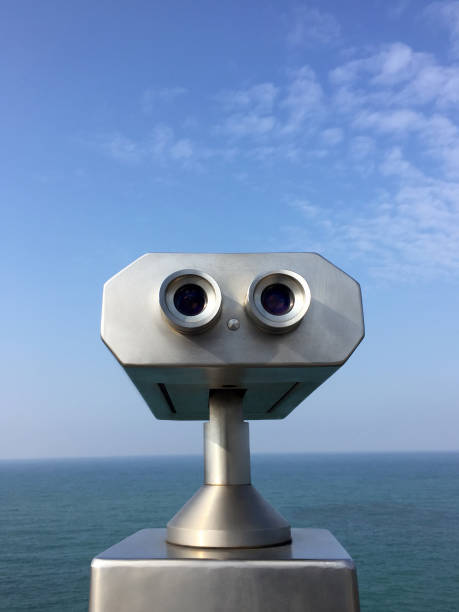 istock Binoculars with sea and sky background 1369013383