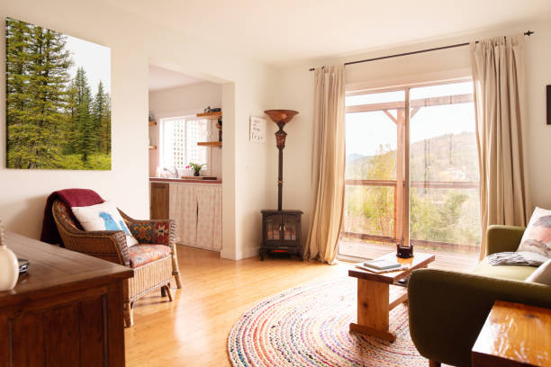 Living room with patio doors leading out to a deck with a view