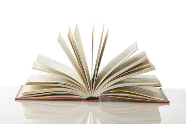 istock Open book, hardback books on wooden table. Back to school. Copy space. 1369016786