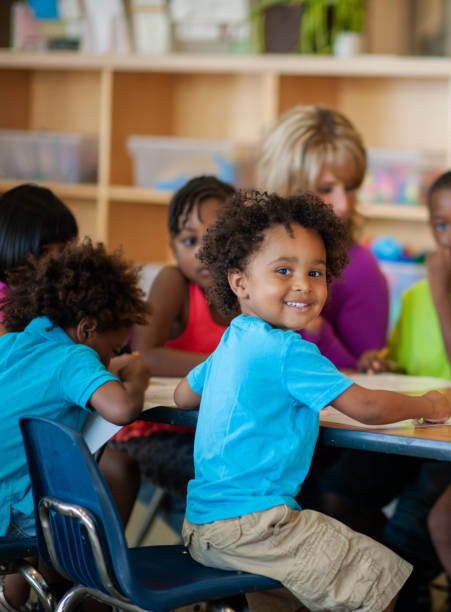 istock Teacher Working with Daycare Children 1369017711